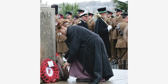 Anya laying the wreath by Kevin Moore.