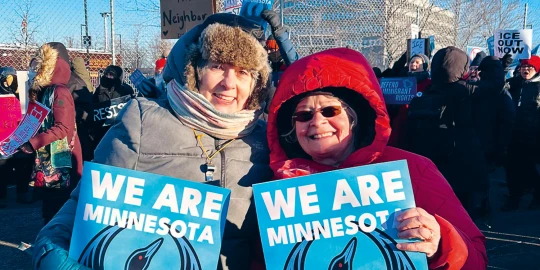 Two Friends protesting ICE (© Julie Doherty).